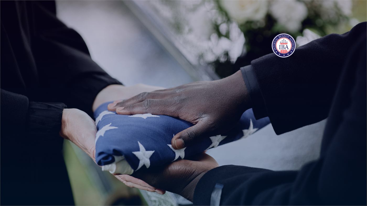 Two pairs of hands passing a folded American flag between them at a military funeral