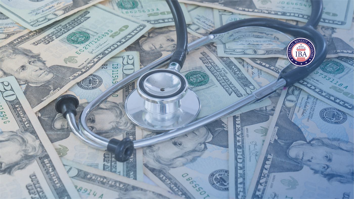 A stethoscope lying across a spread of US twenty dollar bills