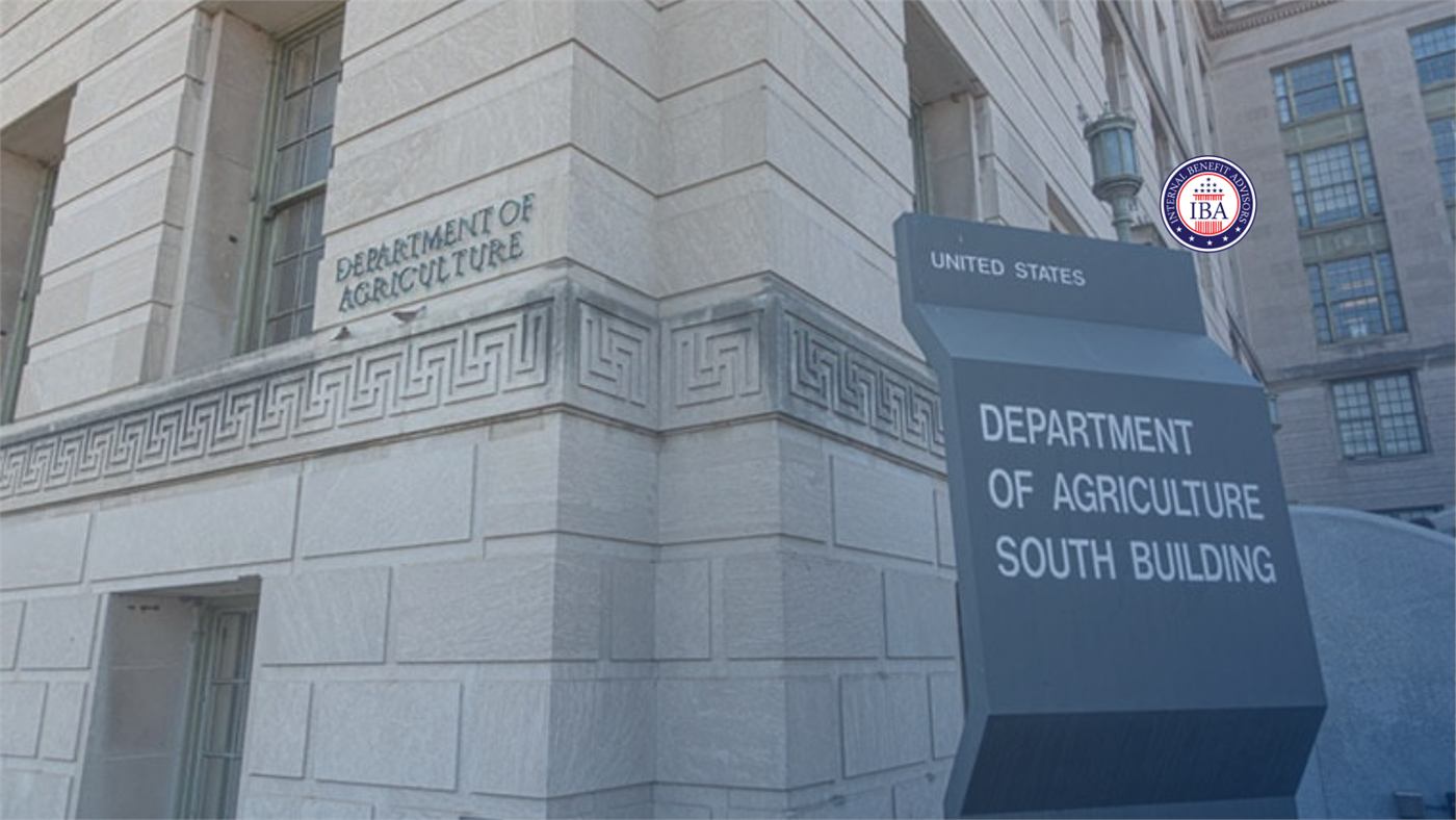 A sign reading United States Department of Agriculture South Building outside a stone government building