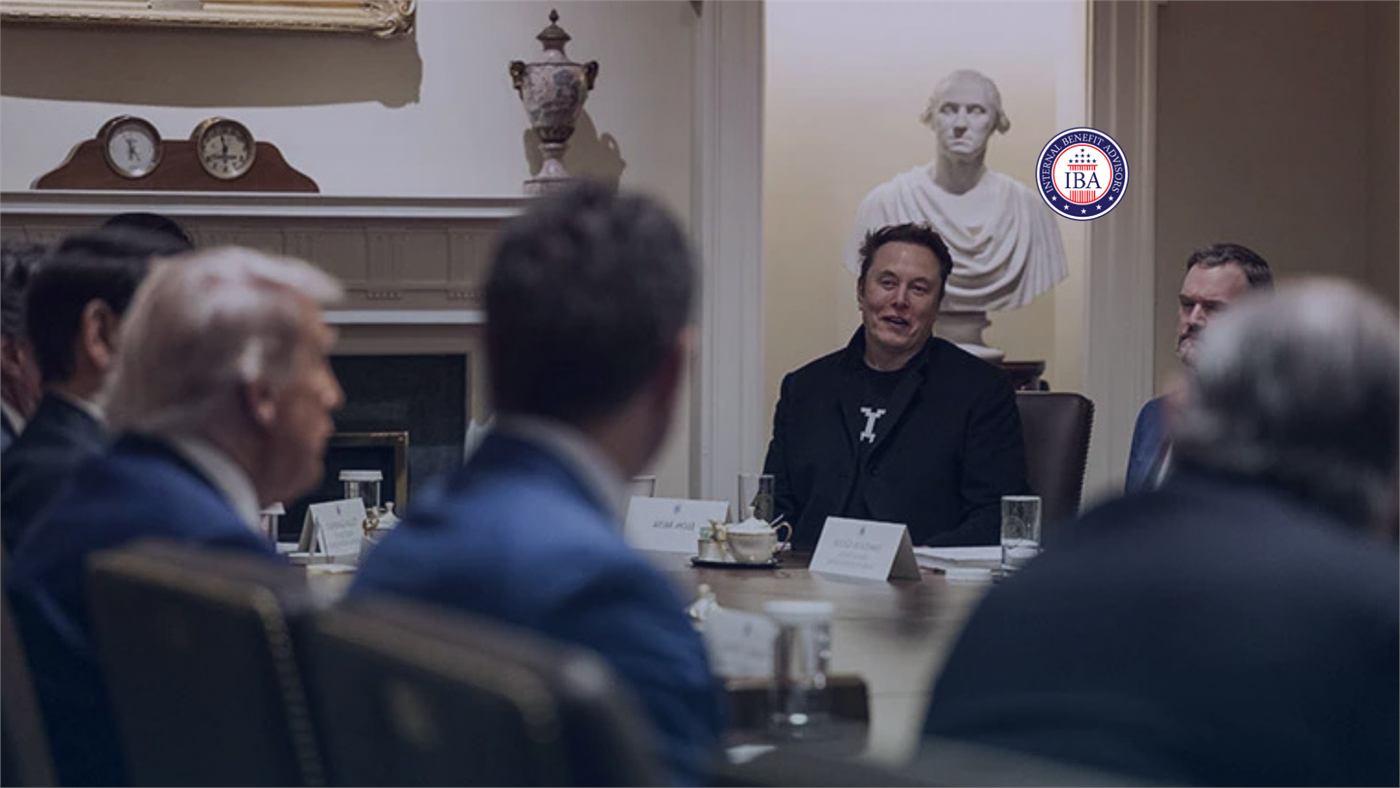 Elon Musk seated at a table with government officials during a meeting in a formal room