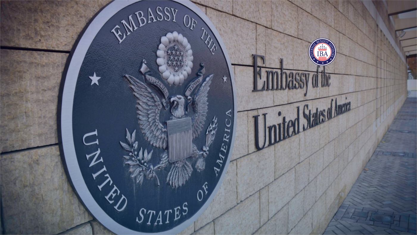 The seal and lettering of the Embassy of the United States of America mounted on a stone wall