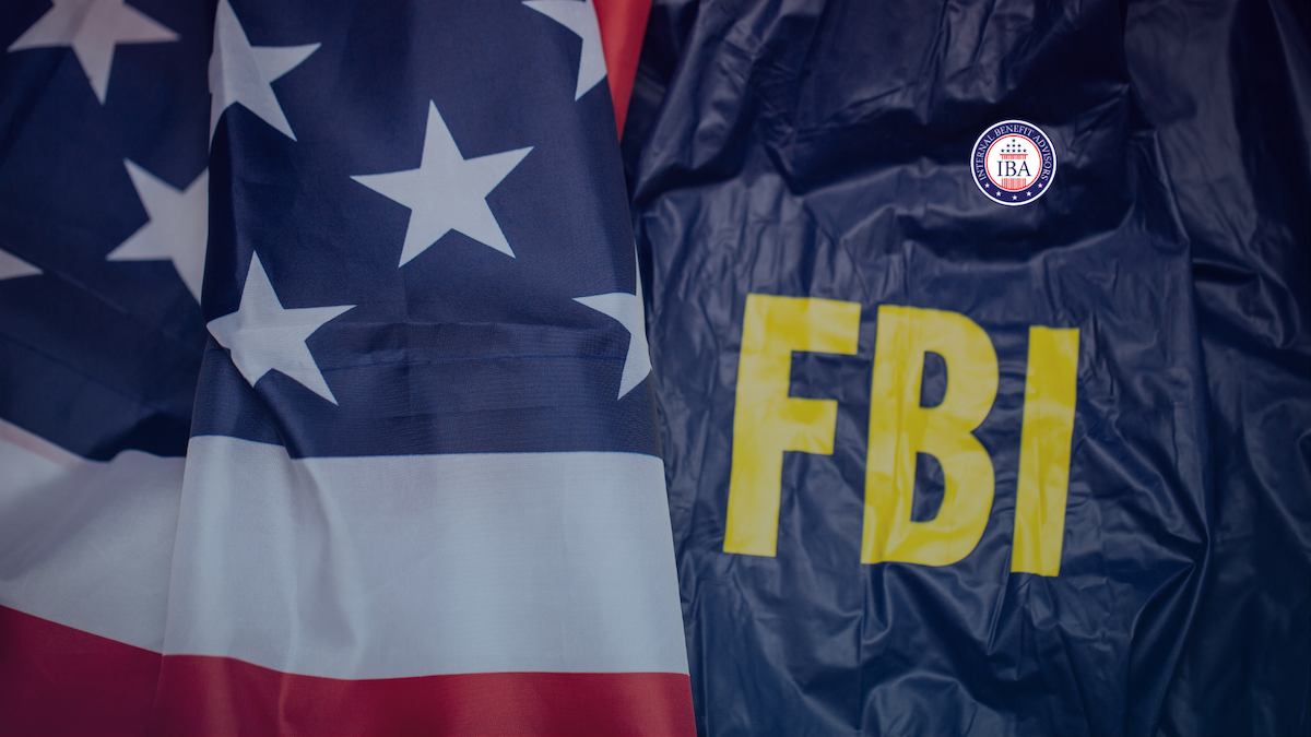An FBI jacket beside a folded American flag