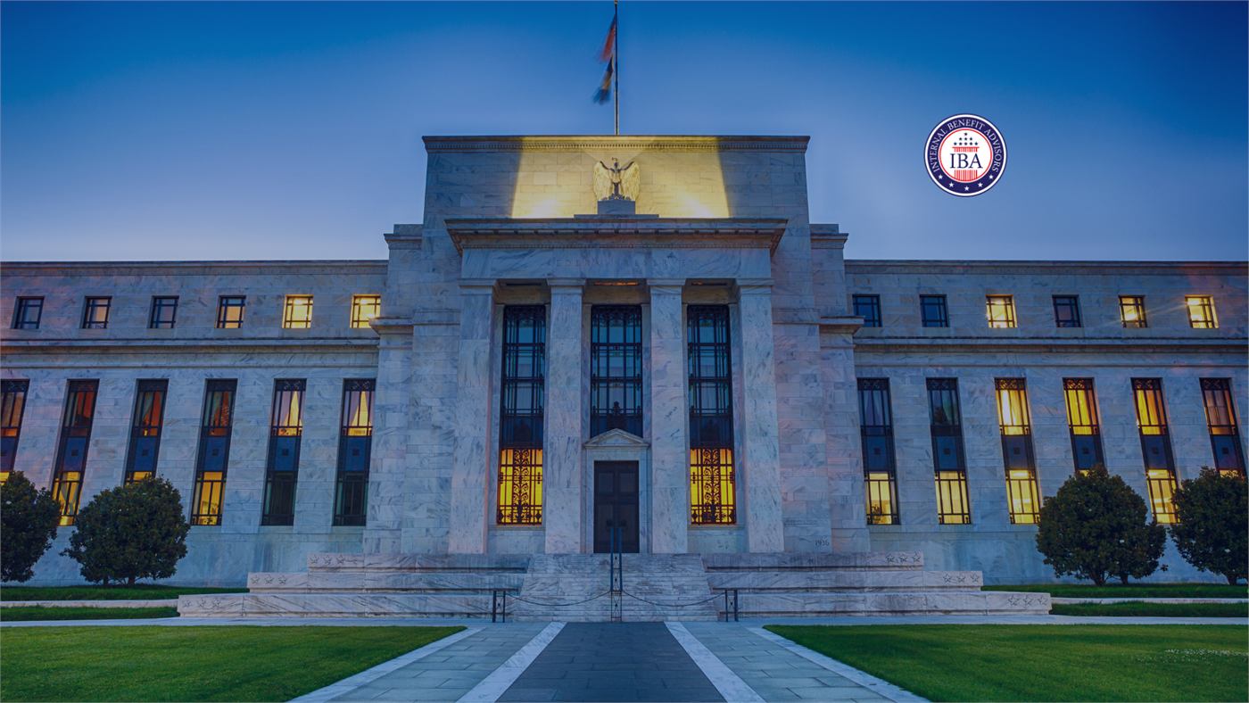 The Federal Reserve building lit from within at dusk