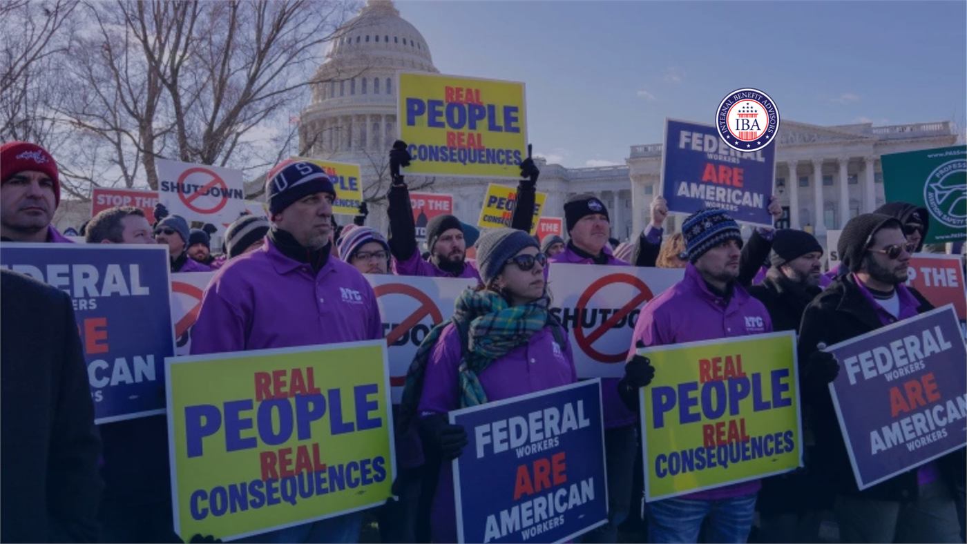 Demonstrators outside a government building holding placards reading Real People Real Consequences and Federal Workers Are American Workers