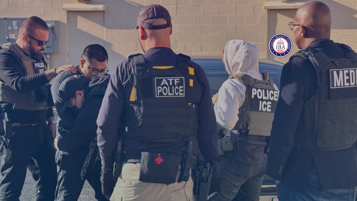 Federal law enforcement officers in ATF, ICE and police vests detaining a person