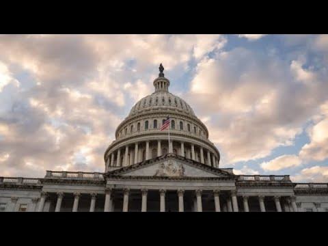 The Capitol dome beneath a cloudy sky at dusk