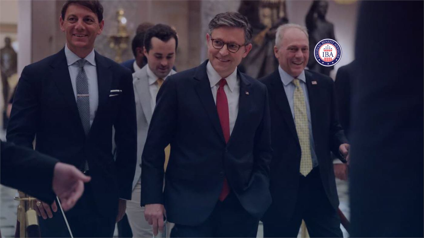 Legislators in suits walking together through a corridor