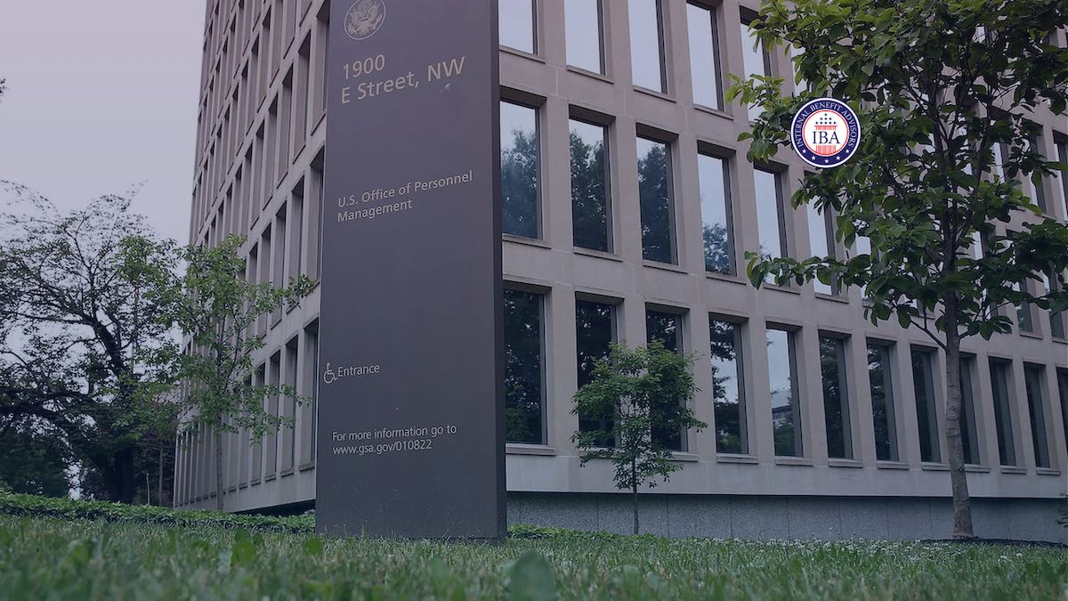 A sign reading 1900 E Street NW, U.S. Office of Personnel Management, outside the building