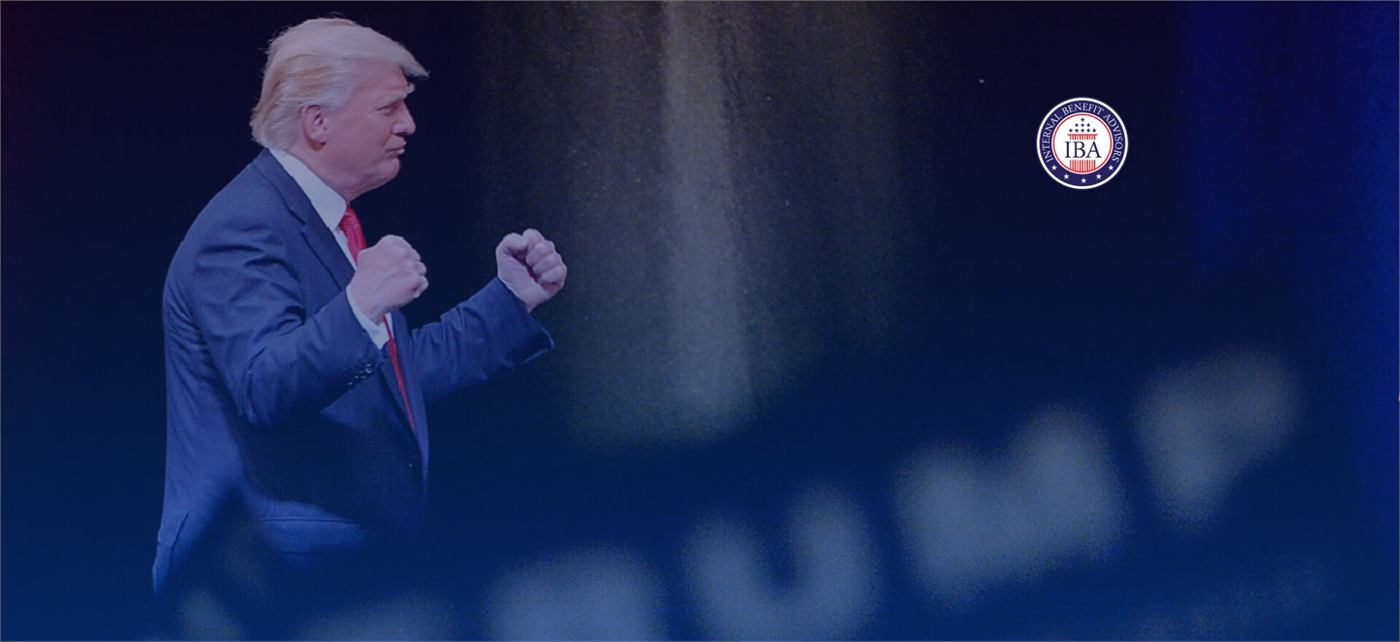 Donald Trump speaking at a podium against a blue backdrop