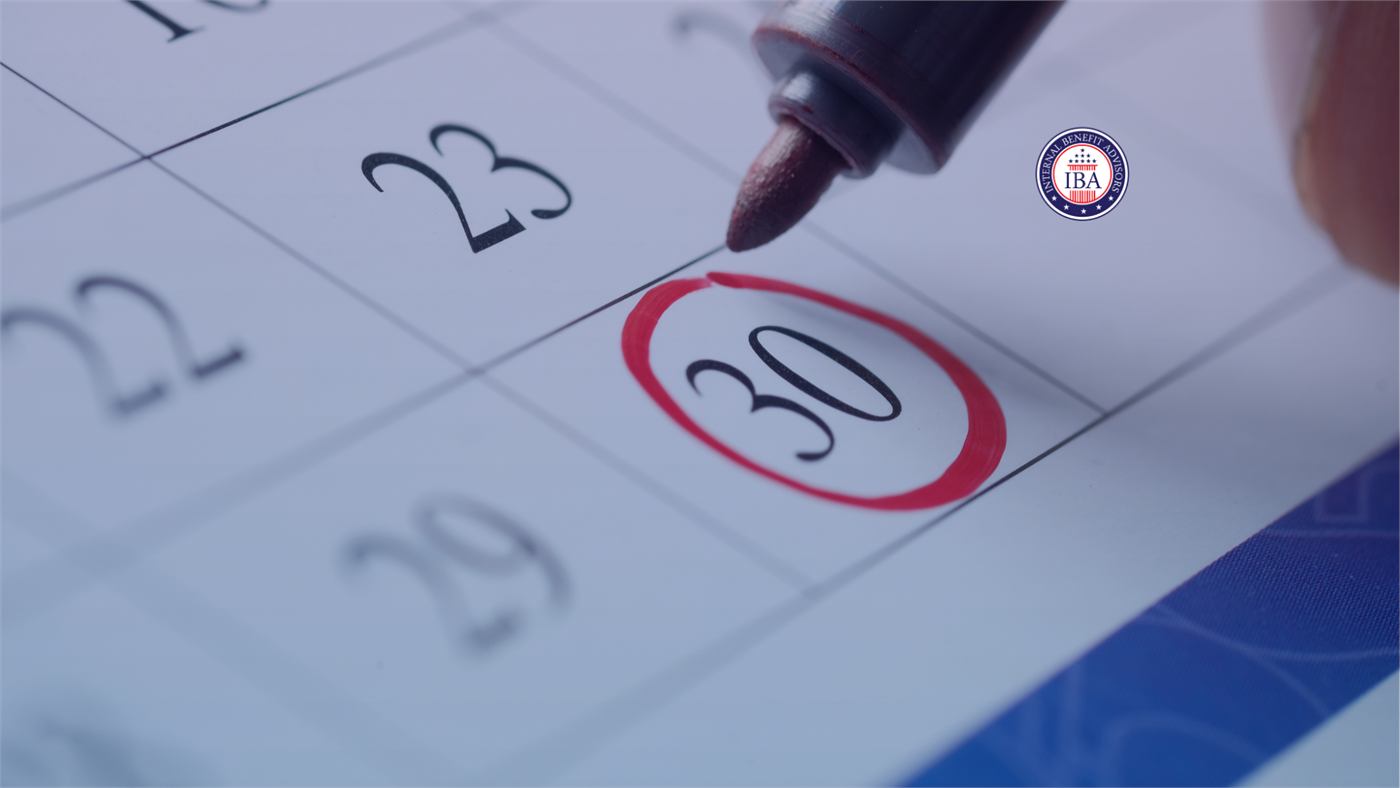 A red marker circling the 30th on a wall calendar