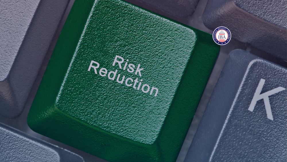 A green computer key labelled Risk Reduction on a keyboard