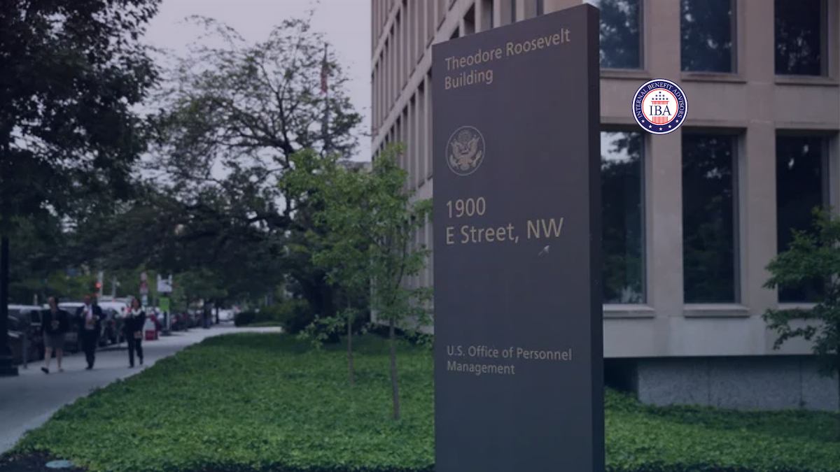 A sign reading 1900 E Street NW, U.S. Office of Personnel Management, outside the Theodore Roosevelt Building