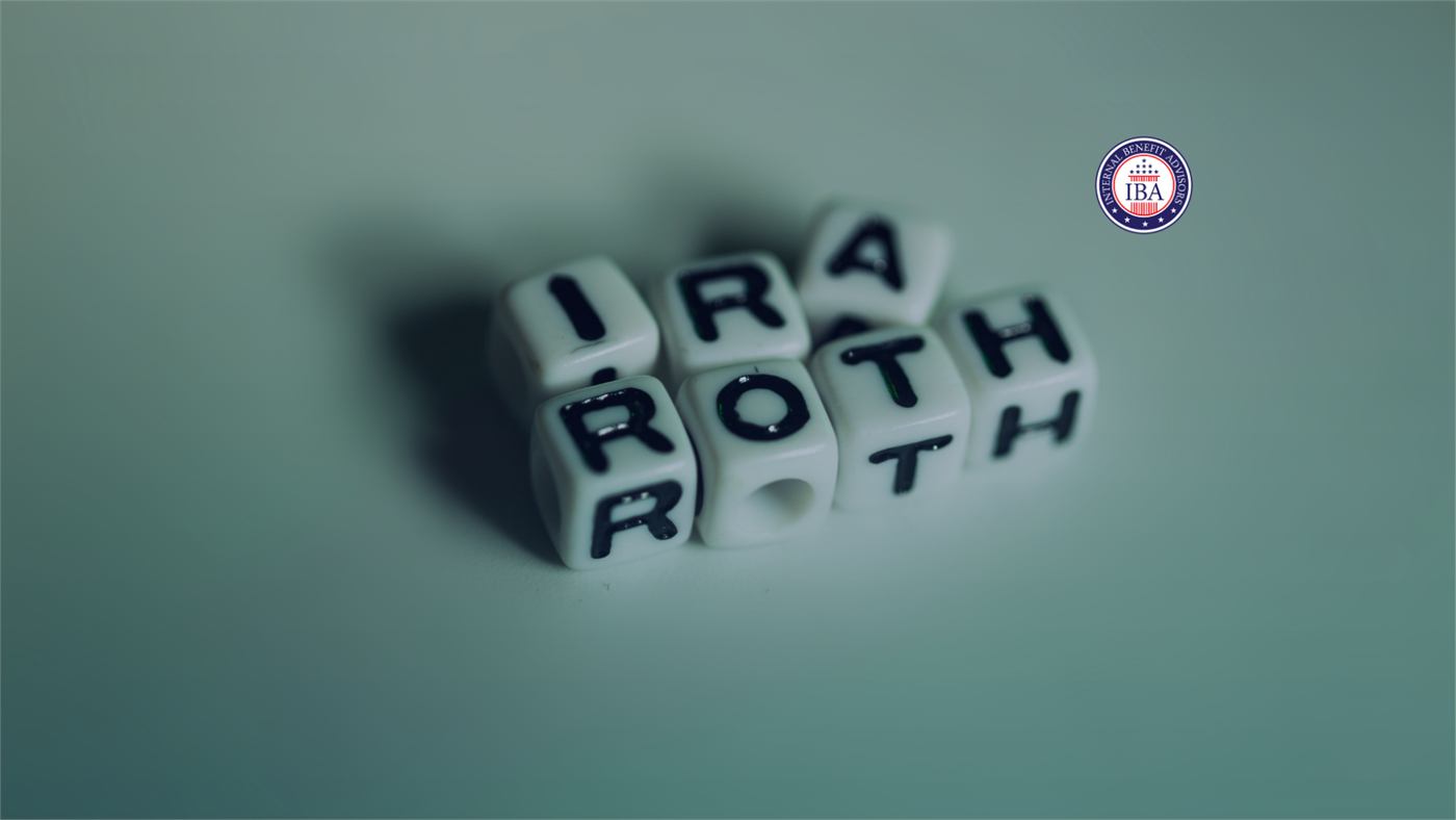 Letter dice arranged to spell IRA and ROTH on a green background