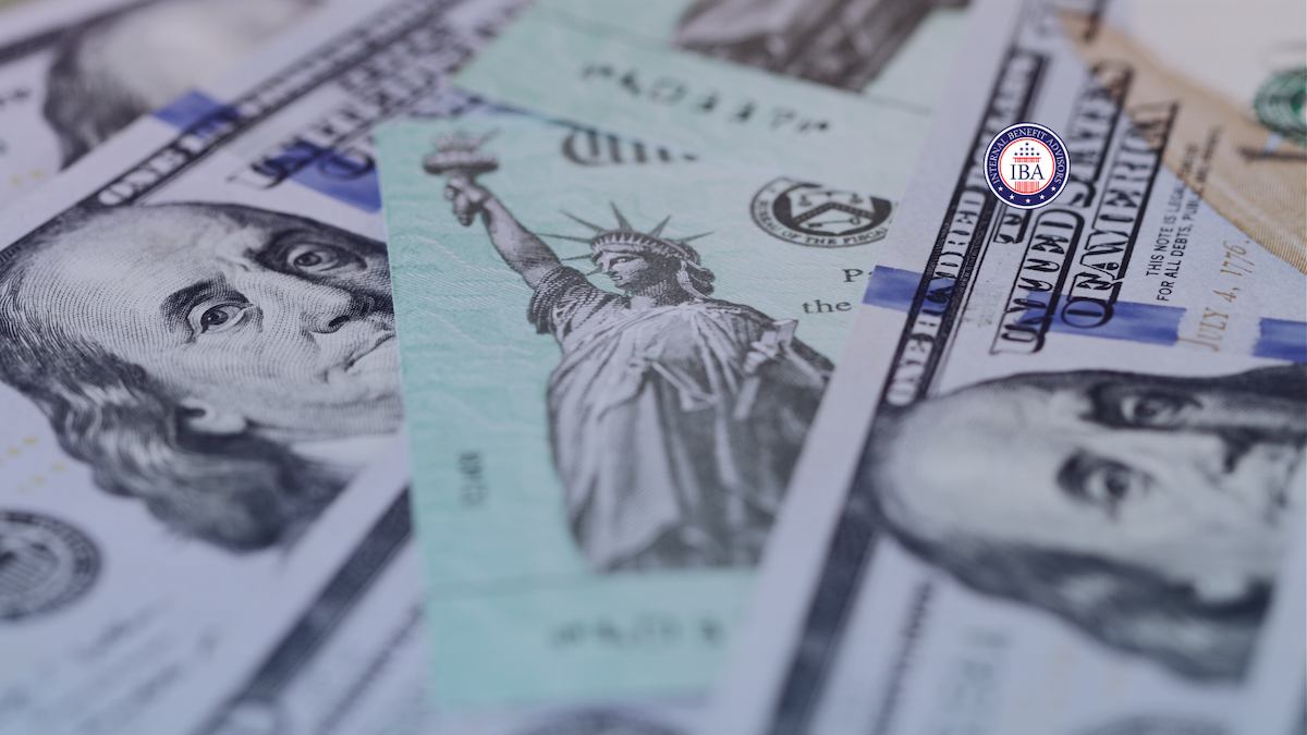 A US banknote showing the Statue of Liberty among hundred dollar bills