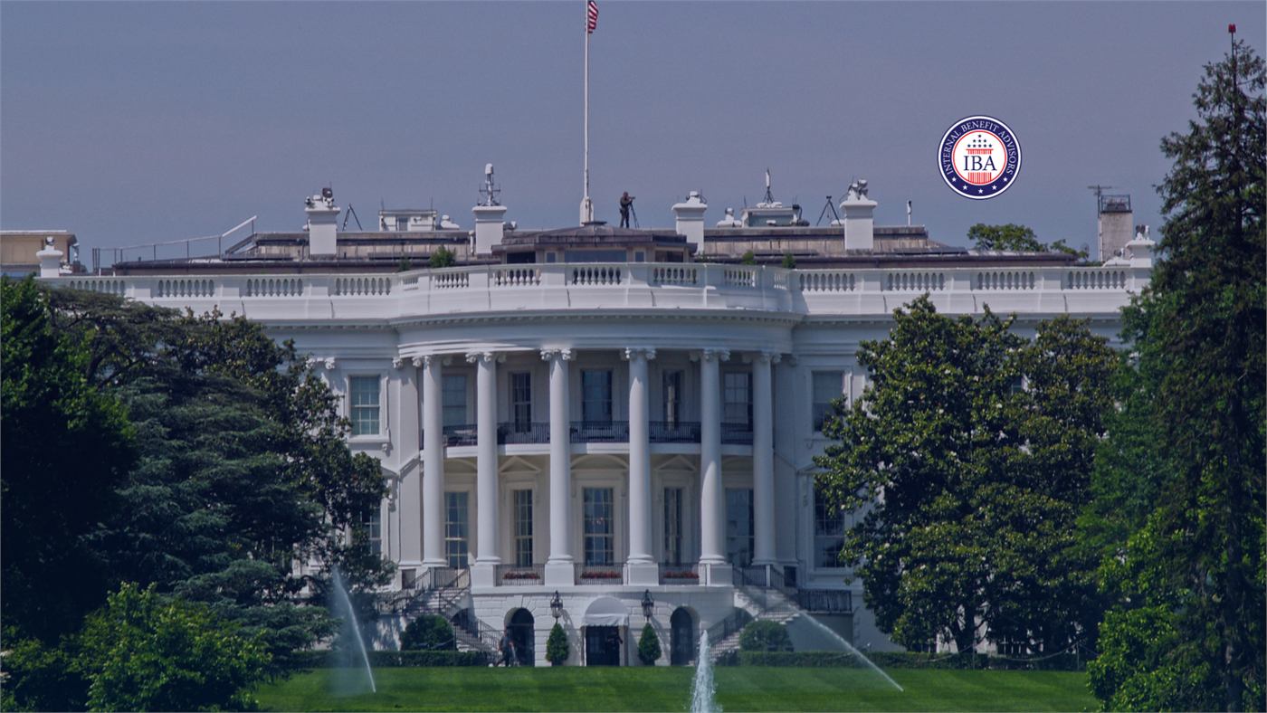 The north front of the White House behind trees and the fountain